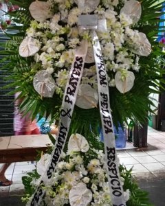 White roses, Anthuriums, mums & orchids Arrangement